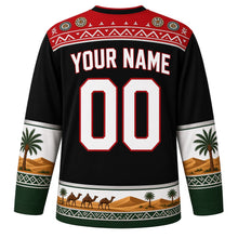 Load image into Gallery viewer, Sudan Original Hockey Jersey in Meroe Black, back view with your name and number – Nubian painted-wall yoke and palm-frond weave sleeve bands
