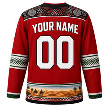 Load image into Gallery viewer, Sudan Original Hockey Jersey in Nubian Red, back view with your name and number – Nubian painted-wall yoke and palm-frond weave sleeve bands
