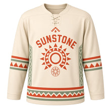 Load image into Gallery viewer, Sun Stone Geometric Original Hockey Jersey in Sandstone Cream, front view – original geometric sun disc with stepped diamond side pattern and eight-ray sun crest, custom name and number