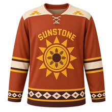 Load image into Gallery viewer, Sun Stone Geometric Original Hockey Jersey in Terracotta Sun, front view – original geometric sun disc with stepped diamond side pattern and eight-ray sun crest, custom name and number