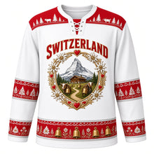 Load image into Gallery viewer, Switzerland Original Hockey Jersey in Glacier White, front view – ornate heart-shaped papercut crest with Matterhorn, chalet, cowbells and alphorns, detailed artwork, custom name and number