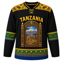 Load image into Gallery viewer, Tanzania Original Hockey Jersey in Ebony Night, front view – ornate Zanzibar carved-door crest with Kilimanjaro and giraffe in Tingatinga style, detailed artwork, custom name and number