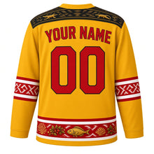 Load image into Gallery viewer, Timor-Leste Original Hockey Jersey in Coffee Blossom Yellow, back view with your name and number – tais ikat-weave yoke and babadok drum sleeve bands