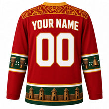 Load image into Gallery viewer, Togo Original Hockey Jersey in Agbadza Red, back view with your name and number – Ewe kente strip-weave yoke and agbadza drum sleeve bands