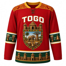 Load image into Gallery viewer, Togo Original Hockey Jersey in Agbadza Red, front view – ornate takienta tower-house shield crest with savanna elephant and agbadza drums, kente yoke, detailed artwork, custom name and number
