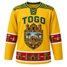 Load image into Gallery viewer, Togo Original Hockey Jersey in Savanna Gold, front view – ornate takienta tower-house shield crest with savanna elephant and agbadza drums, kente yoke, detailed artwork, custom name and number