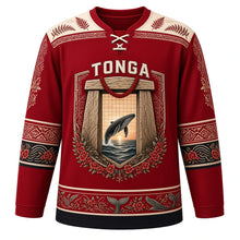 Load image into Gallery viewer, Tonga Original Hockey Jersey in Kalia Crimson, front view – ornate trilithon gateway crest with heilala garland and breaching humpback whale, ngatu tapa yoke, detailed artwork, custom name and number