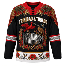 Load image into Gallery viewer, Trinidad and Tobago Original Hockey Jersey in Steelpan Black, front view – ornate steelpan crest with scarlet ibis, cocrico and chaconia, carnival-plumage yoke, detailed artwork, custom name and number