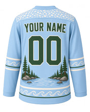 Load image into Gallery viewer, Trout Stream Angler Original Hockey Jersey in Glacier Blue, back view with your name and number – river-pebble yoke and fishing-line sleeve bands