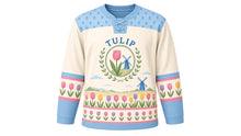 Load image into Gallery viewer, Tulip Windmill Fields Original Hockey Jersey in Field Cream, front view – rows of tulips and a windmill on the horizon with tulip crest, custom name and number
