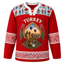 Load image into Gallery viewer, Turkey Original Hockey Jersey in Anatolian Red, front view – ornate tulip-shaped crest with Cappadocia fairy chimneys, balloons and Iznik flowers, detailed artwork, custom name and number