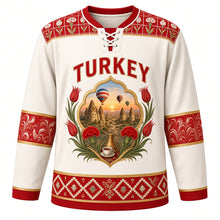 Load image into Gallery viewer, Turkey Original Hockey Jersey in Pamukkale White, front view – ornate tulip-shaped crest with Cappadocia fairy chimneys, balloons and Iznik flowers, detailed artwork, custom name and number
