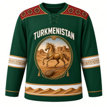 Load image into Gallery viewer, Turkmenistan Original Hockey Jersey in Kopetdag Pine, front view – ornate oval medallion with golden Akhal-Teke horse, Kyz Kala walls and dutar, carpet-gul yoke, detailed artwork, custom name and number