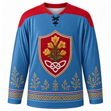 Load image into Gallery viewer, Tynwald Day Original Hockey Jersey in Irish Sea Blue, front view with themed artwork and clean crest