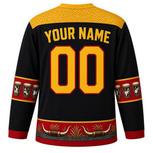 Load image into Gallery viewer, Uganda Original Hockey Jersey in Crane Black, back view with your name and number – barkcloth and basketry yoke and ngoma drum sleeve bands