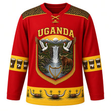 Load image into Gallery viewer, Uganda Original Hockey Jersey in Nile Red, front view – ornate barkcloth-banner crest with dancing crowned cranes, Murchison Falls and Ankole cattle, detailed artwork, custom name and number