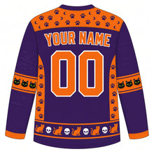 Load image into Gallery viewer, Ugly Halloween Black Cat Curse Hockey Jersey in Witch Purple, back view with a paw print and skull yoke, witch broom sleeve bands, black cat hem band, arched YOUR NAME lettering and 00 – custom name and number