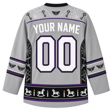 Load image into Gallery viewer, Ugly Halloween Haunted Doll Attic Hockey Jersey in Attic Dust Gray, back view with a cobweb-and-key yoke, spinning-top-and-moth sleeve bands, rocking-horse-and-candle hem band, arched YOUR NAME lettering and 00 – custom name and number