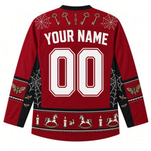 Load image into Gallery viewer, Ugly Halloween Haunted Doll Attic Hockey Jersey in Blood Moon Red, back view with a cobweb-and-key yoke, spinning-top-and-moth sleeve bands, rocking-horse-and-candle hem band, arched YOUR NAME lettering and 00 – custom name and number