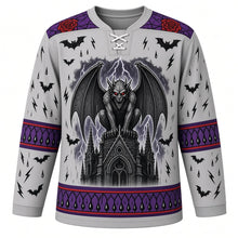 Load image into Gallery viewer, Ugly Halloween Gargoyle Cathedral Hockey Jersey in Stone Gray, front view – stone gray body with a winged stone gargoyle with glowing eyes crest on a gothic spire with stained-glass rose windows, rain, lightning and bats, rose window yoke, gothic arch sleeve bands and a spire hem band – custom name and number