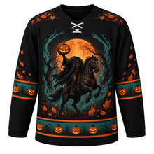 Load image into Gallery viewer, Ugly Halloween Headless Rider Hollow Hockey Jersey in Midnight Black, front view – midnight black body with orange and teal trim with a headless rider in a tattered cloak on a rearing black horse holding a glowing jack-o'-lantern, twisted hollow trees and a covered bridge in fog, swirling-leaf yoke, horseshoe sleeve bands and a tree-and-pumpkin hem band – custom name and number
