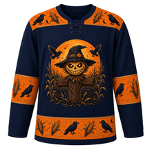 Load image into Gallery viewer, Ugly Halloween Scarecrow Cornfield Fright Hockey Jersey in Midnight Black, front view – midnight black body with a grinning stitched-burlap scarecrow crest with glowing eyes in a moonlit cornfield with circling crows, corn and crow yoke, corn cob sleeve bands and a cornstalk hem band – custom name and number