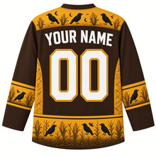 Load image into Gallery viewer, Ugly Halloween Scarecrow Cornfield Fright Hockey Jersey in Cornstalk Brown, back view with a corn and crow yoke, corn cob sleeve bands, cornstalk hem band, arched YOUR NAME lettering and 00 – custom name and number