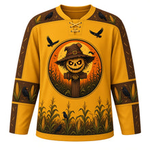 Load image into Gallery viewer, Ugly Halloween Scarecrow Cornfield Fright Hockey Jersey in Harvest Gold, front view – harvest gold body with a grinning stitched-burlap scarecrow crest with glowing eyes in a moonlit cornfield with circling crows, corn and crow yoke, corn cob sleeve bands and a cornstalk hem band – custom name and number