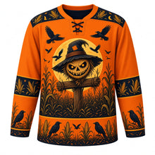 Load image into Gallery viewer, Ugly Halloween Scarecrow Cornfield Fright Hockey Jersey in Pumpkin Orange, front view – pumpkin orange body with a grinning stitched-burlap scarecrow crest with glowing eyes in a moonlit cornfield with circling crows, corn and crow yoke, corn cob sleeve bands and a cornstalk hem band – custom name and number