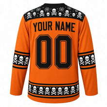 Load image into Gallery viewer, Ugly Halloween Rattling Skeletons Hockey Jersey in Pumpkin Orange, back view with a skull and crossbones yoke, bone sleeve bands, skull hem band, arched YOUR NAME lettering and 00 – custom name and number