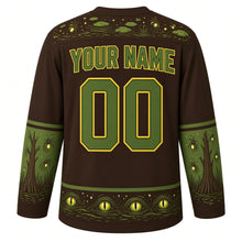 Load image into Gallery viewer, Ugly Halloween Swamp Creature Bayou Hockey Jersey in Bog Brown, back view with a moss and firefly yoke, lily pad sleeve bands, cypress tree hem band, arched YOUR NAME lettering and 00 – custom name and number