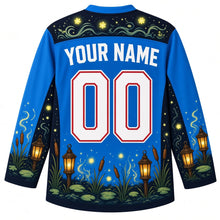 Load image into Gallery viewer, Ugly Halloween Will-o-Wisp Bog Lanterns Hockey Jersey in Spectral Blue, back view with a lantern and wisp yoke, lantern and cattail sleeve bands, lantern-post hem band, arched YOUR NAME lettering and 00 – custom name and number