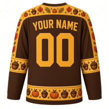 Load image into Gallery viewer, Ugly Thanksgiving Acorn Squirrel Hockey Jersey in Acorn Brown, back view with an acorn and oak leaf yoke, acorn sleeve bands, acorn and pumpkin hem band, arched YOUR NAME lettering and 00 – custom name and number