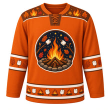 Load image into Gallery viewer, Ugly Thanksgiving Autumn Bonfire Night Hockey Jersey in Ember Orange, front view – round crest of a campfire in a stone ring under a starry night sky with marshmallows on sticks and autumn leaves, brown yoke of flames and leaves, marshmallow-on-stick and leaf sleeve bands and a hem of mini campfires alternating with marshmallows – custom name and number