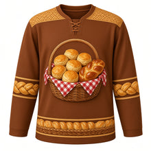 Load image into Gallery viewer, Ugly Thanksgiving Harvest Bread Basket Hockey Jersey in Cinnamon Brown, front view – cinnamon brown body with golden crust yoke with a round crest of an overflowing woven wicker basket lined with red gingham and piled with golden dinner rolls, a braided loaf and flaky biscuits, basket-weave yoke, biscuit and braided-twist sleeve bands and a mini bread-basket hem band – custom name and number