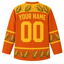 Load image into Gallery viewer, Ugly Thanksgiving Corn Cob Crew Hockey Jersey in Burnt Orange, back view with a yoke of corn ears and kernels, corn-ear and husk-leaf sleeve and hem bands, arched YOUR NAME lettering and 00 – custom name and number