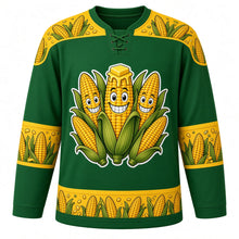Load image into Gallery viewer, Ugly Thanksgiving Corn Cob Crew Hockey Jersey in Husk Green, front view – husk green body with corn yellow yoke with three grinning cartoon corn cobs in peeled-back green husks with golden kernels and a melting butter pat, a corn-ear and kernel yoke, corn-ear sleeve bands and a corn-cob hem band – custom name and number