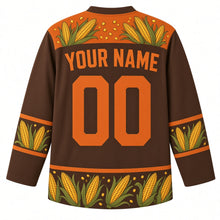 Load image into Gallery viewer, Ugly Thanksgiving Corn Cob Crew Hockey Jersey in Mocha Brown, back view with a yoke of corn ears and kernels, corn-ear and husk-leaf sleeve and hem bands, arched YOUR NAME lettering and 00 – custom name and number