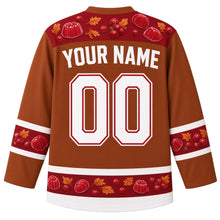 Load image into Gallery viewer, Ugly Thanksgiving Cranberry Sauce Wobble Hockey Jersey in Cinnamon Brown, back view with cranberries, jelly slices and molded-jelly shapes with autumn leaves on the yoke, sleeve bands and hem band, arched YOUR NAME lettering and 00 – custom name and number
