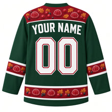 Load image into Gallery viewer, Ugly Thanksgiving Cranberry Sauce Wobble Hockey Jersey in Forest Green, back view with cranberries, jelly slices and molded-jelly shapes with autumn leaves on the yoke, sleeve bands and hem band, arched YOUR NAME lettering and 00 – custom name and number