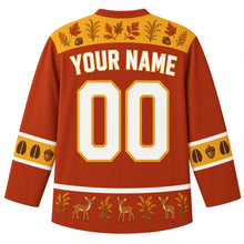 Load image into Gallery viewer, Ugly Thanksgiving Autumn Deer Meadow Hockey Jersey in Rust Red, back view with a gold goldenrod-and-leaf yoke, hoof-print and acorn sleeve bands, a fawn hem band, YOUR NAME lettering and 00 – custom name and number
