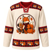 Load image into Gallery viewer, Ugly Thanksgiving Cozy Flannel Fox Hockey Jersey in Oatmeal Cream, front view – oatmeal cream body with flannel red yoke with a round crest of a smiling cartoon red fox in a buffalo plaid flannel scarf holding a steaming cider mug beside a pumpkin and autumn leaves, plaid-and-fox yoke, plaid and acorn sleeve bands and a sleeping-fox hem band – custom name and number