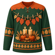 Load image into Gallery viewer, Ugly Thanksgiving Gratitude Leaf Garland Hockey Jersey in Forest Green, front view – forest green body with rust orange yoke with orange and tan lobed oak leaves and acorns on rustic twine with wooden clothespins, two glowing pillar candles over pumpkins with a mini pie, wheat and red berries, and oak-leaf sleeve and hem bands – custom name and number