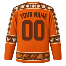 Load image into Gallery viewer, Ugly Thanksgiving Gravy Boat Feast Hockey Jersey in Pumpkin Orange, back view with a fork, knife and plate yoke, gravy boat and roll sleeve bands, pie and turkey hem band, arched YOUR NAME lettering and 00 – custom name and number