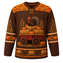 Load image into Gallery viewer, Ugly Thanksgiving Hayride Haystack Hockey Jersey in Chestnut Brown, front view – chestnut brown body with pumpkin orange yoke with a hay wagon crest piled with hay bales, pumpkins and corn stalks with a cartoon turkey on top, hay-bale and corn yoke, pumpkin and corn sleeve bands and a hay-bale hem band – custom name and number