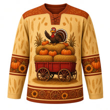 Load image into Gallery viewer, Ugly Thanksgiving Hayride Haystack Hockey Jersey in Straw Gold, front view – straw gold body with rust brown yoke with a hay wagon crest piled with hay bales, pumpkins and corn stalks with a cartoon turkey on top, hay-bale and corn yoke, pumpkin and corn sleeve bands and a hay-bale hem band – custom name and number