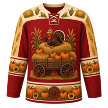 Load image into Gallery viewer, Ugly Thanksgiving Hayride Haystack Hockey Jersey in Barn Red, front view – barn red body with cream yoke with a hay wagon crest piled with hay bales, pumpkins and corn stalks with a cartoon turkey on top, hay-bale and corn yoke, pumpkin and corn sleeve bands and a hay-bale hem band – custom name and number