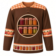 Load image into Gallery viewer, Ugly Thanksgiving Mason Jar Preserves Hockey Jersey in Apple Butter Brown, front view – apple butter brown body with peach amber gingham yoke with a round crest of a rustic wooden pantry shelf of blank label-free glass canning jars glowing with cranberry jam, apple butter, peach preserves and pickles under red-and-white gingham lids, cream sleeve bands of peaches, apples and cranberries and a mini canning-jar hem band – custom name and number