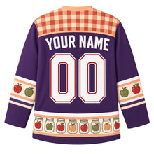 Load image into Gallery viewer, Ugly Thanksgiving Mason Jar Preserves Hockey Jersey in Fig Purple, back view with a red and peach gingham yoke, red and green apple sleeve bands, a hem band of glass jars holding apples, arched YOUR NAME lettering and 00 – custom name and number