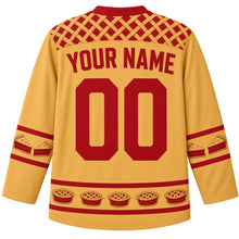 Load image into Gallery viewer, Ugly Thanksgiving Lattice Pie Bakery Hockey Jersey in Pie Crust Gold, back view with a cherry lattice pie-crust yoke, pie-slice sleeve bands, mini lattice-pie hem band, arched YOUR NAME lettering and 00 – custom name and number